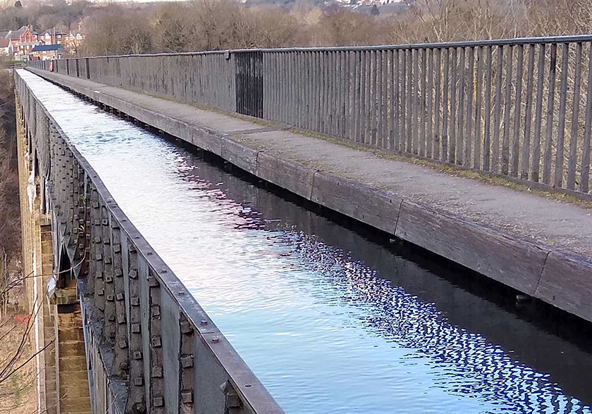 Trough showing water goes under towpath