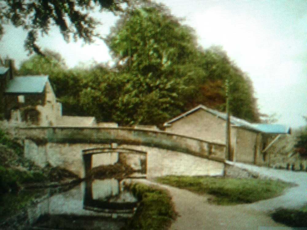 Monks Bridge and warehouse old postcard